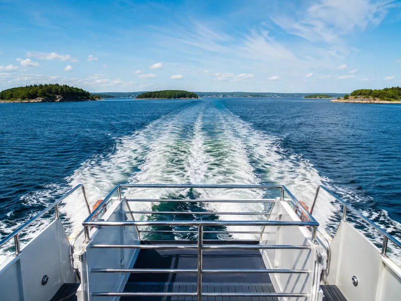 A passenger ferry crossing the Hauraki Gulf towards Waiheke Island